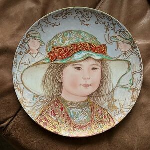 Porcelain collector plate by Edna Hibel